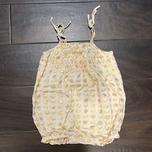 Cutest little boho onesie with gold eyes